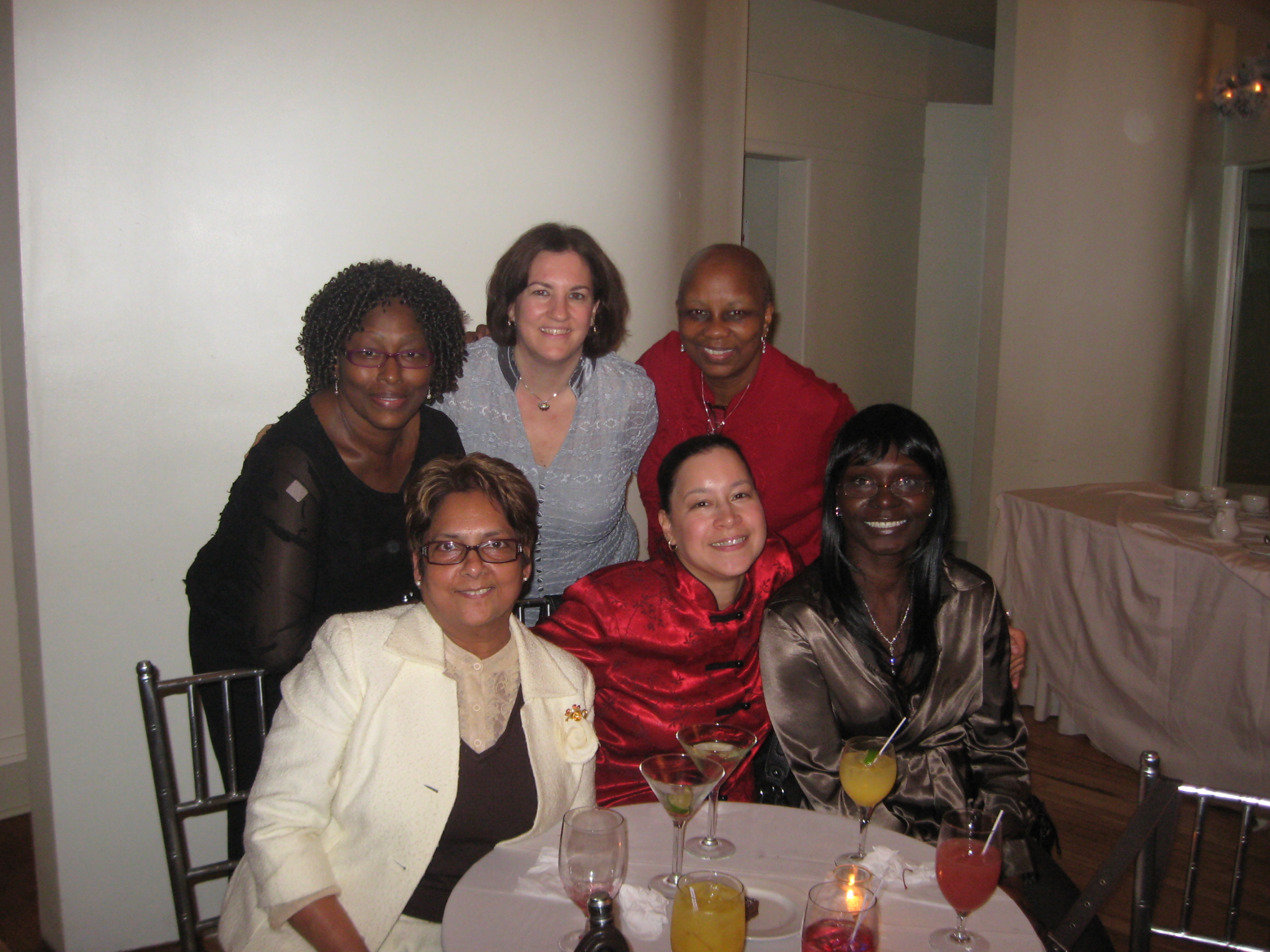 In the Holiday Spirit: top row (l. to r.) Mary Paul Desuza, Debbie Briffa, Verna Fulton; bottom row: Susheila Elahie, Carmen Rios, Michele Bostic